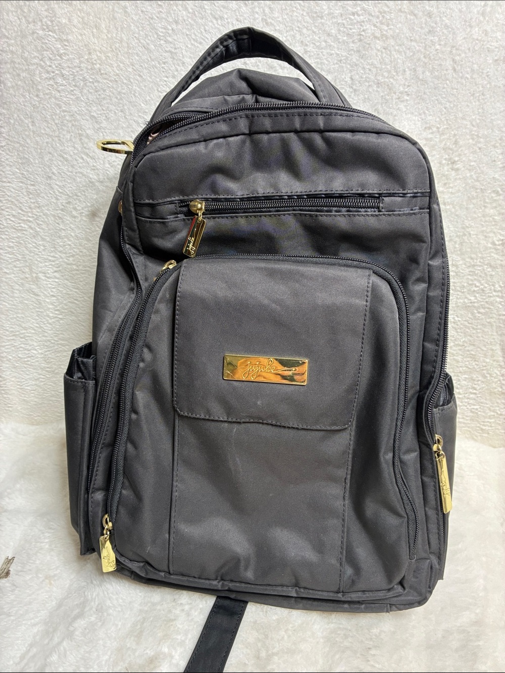Black woman’s Multi-Pocket Backpack - Gold Accents